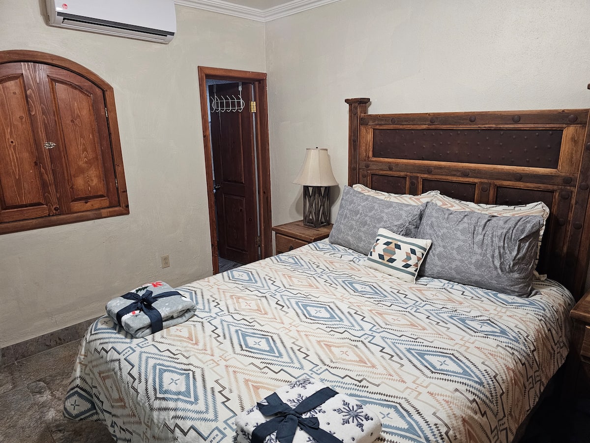 Queen bedroom with rustic wood details